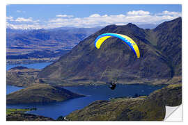 Naklejka na ścianę Paraglider over mountain landscape