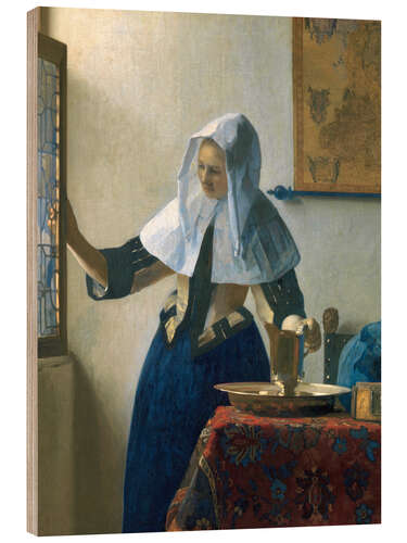 Wood print Young woman with a water jug by the window