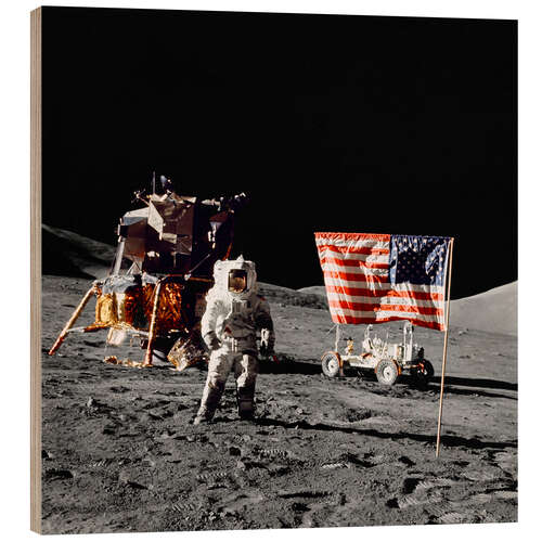 Wood print Apollo 17 astronaut stands near the United States flag