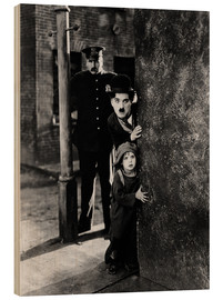 Obraz na drewnie  Charlie Chaplin i Jackie Coogan w filmie "Brzdąc"