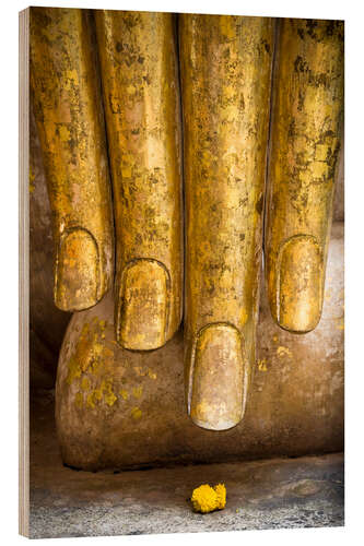 Quadro de madeira Golden fingers of a Buddha statue