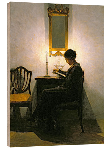 Trebilde Woman reading by candlelight