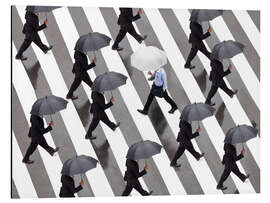 Aluminiumsbilde Man with umbrella and suit runs as a loner against the tide