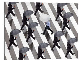 Gallery print Man with umbrella and suit runs as a loner against the tide