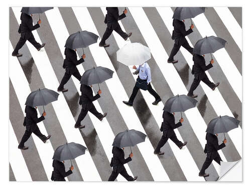 Selvklebende plakat Man with umbrella and suit runs as a loner against the tide