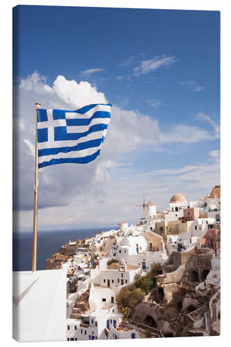 Leinwandbild Griechische Flagge und das Dorf. Oia, Santorini, Griechenland