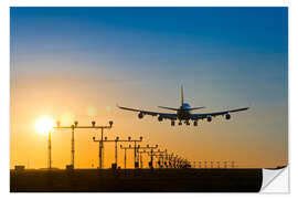 Selvklebende plakat Aeroplane landing at sunset