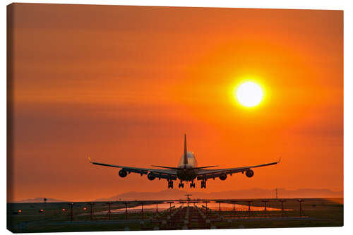 Leinwandbild Flugzeuglandung im Abendlicht