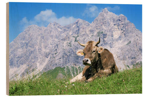 Hout print Cow on a mountain meadow