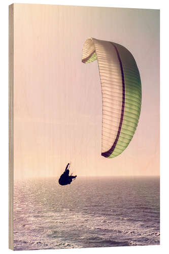 Tableau en bois Paragliding over the ocean