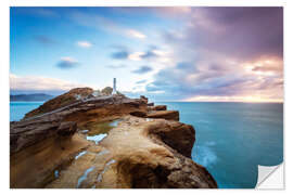 Selvklebende plakat Lighthouse and sea at sunrise on the coast of New Zealand