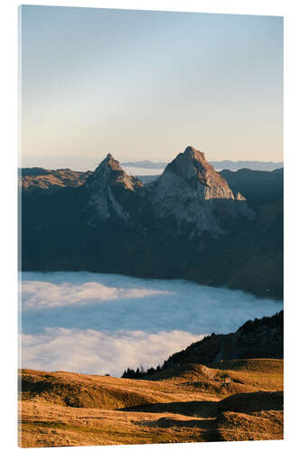 Acrylic print Grosser and Kleiner Mythen mountain peak above cloudscape at sunrise