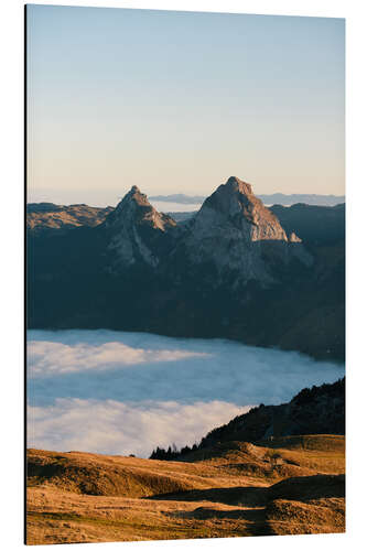 Tableau en aluminium Grosser and Kleiner Mythen mountain peak above cloudscape at sunrise