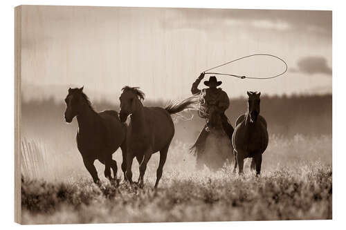 Stampa su legno Cowboy prende al laccio i cavalli