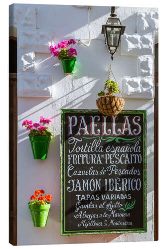 Canvas print Typical whitewashed ornate wall and paella sign, Andalusia Spain