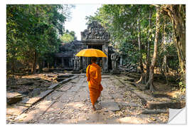 Vinilo para la pared Monk with umbrella walking in Angkor Wat temple, Cambodia