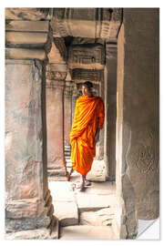 Naklejka na ścianę Monk walking inside Agkor Wat temple, Cambodia