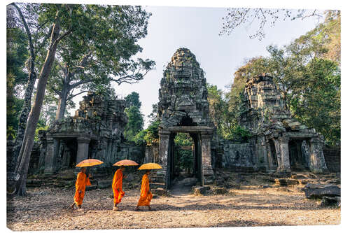 Canvas-taulu Monks with umbrellas inside Angkor Wat temples, Cambodia
