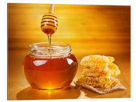 Gallery print jar of honey with honeycomb on wooden table