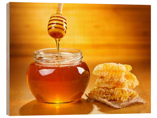 Stampa su legno jar of honey with honeycomb on wooden table