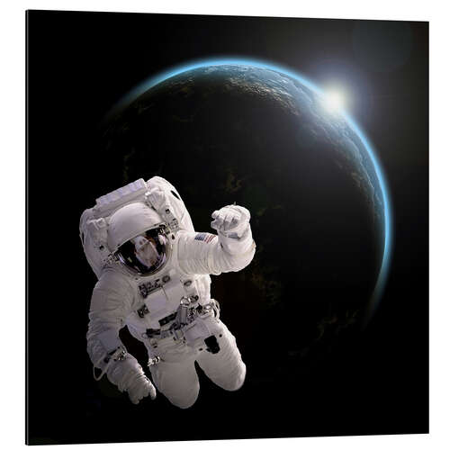 Aluminium print Astronaut floating in space as the sun rises on to Earth-like planet.