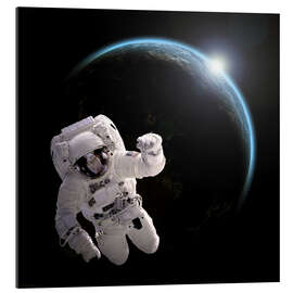 Galleriprint Astronaut floating in space as the sun rises on to Earth-like planet.