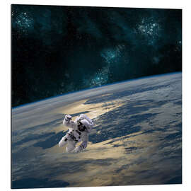 Aluminium print An astronaut floating above Earth.