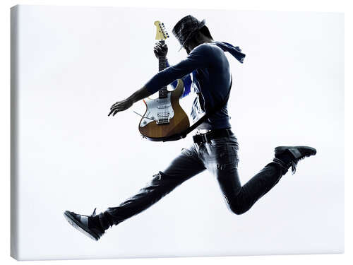 Canvas print Guitarist jumping in the air