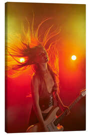 Canvas print Rock girl playing the electric guitar
