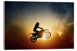 Trebilde Biker jumping at sunset