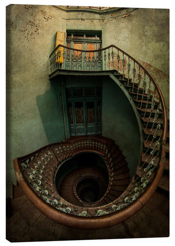 Canvas print Spiral staircase in an old building