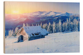 Quadro de madeira Snowy hut at sunset