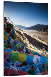 Galleriataulu Valley at sunrise with prayer flags, Tibet