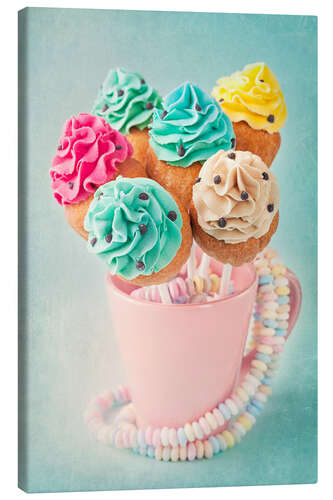 Canvas print Colorful cupcake pops on blue background