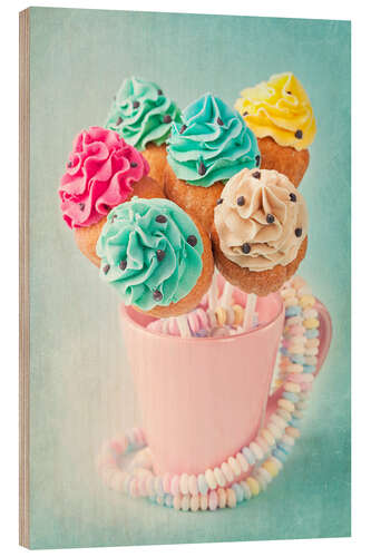 Wood print Colorful cupcake pops on blue background