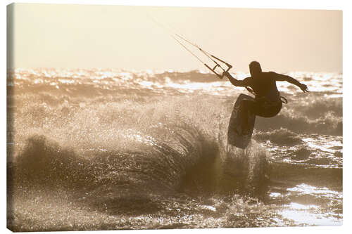 Canvas print Kitesurfer jumping on a beautiful background