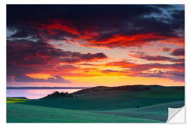 Adesivo murale Rolling green hills and lake at sunset