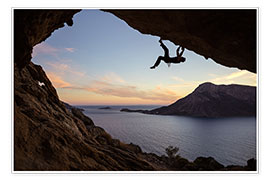 Wall print  Climber in a cave at sunset
