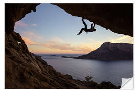 Sticker mural Grimpeur dans une grotte au coucher du soleil