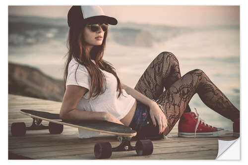 Muursticker Beautiful young woman posing with a skateboard