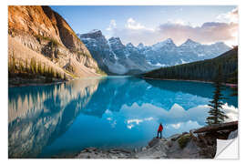 Naklejka na ścianę Man admiring sunset at Moraine lake, Canada