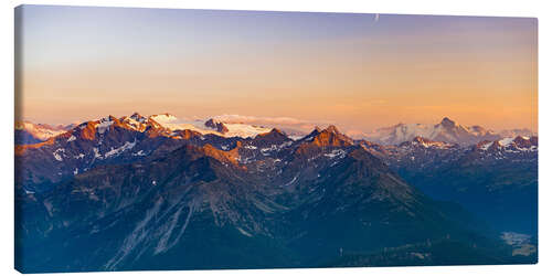 Canvas-taulu Sunset over rocky mountain peaks, ridges and valleys, the Alps