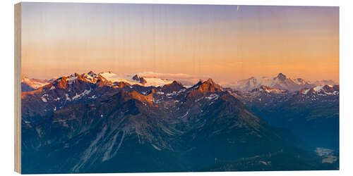 Holzbild Sunset light over rocky mountain peaks, ridges and valleys, the Alps