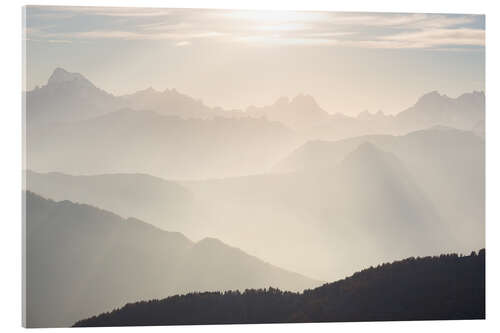 Acrylic print Sunlight behind mountain peaks silhouette, the Alps