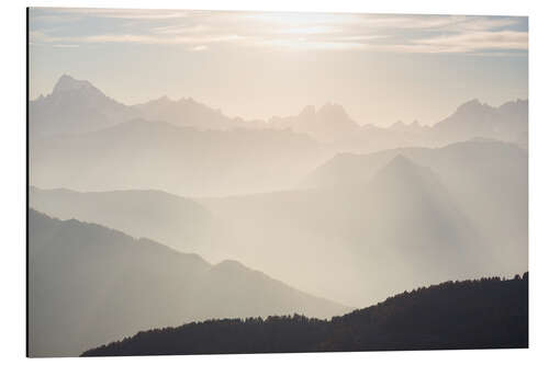 Cuadro de aluminio Sunlight behind mountain peaks silhouette, the Alps.