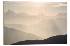 Holzbild Sonnenlicht hinter Bergspitzen, Alpen