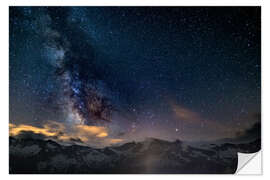 Naklejka na ścianę The Milky Way galaxy glowing over snowcapped mountains in the Alps