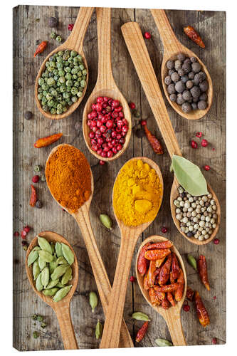 Quadro em tela Colorful spices in wooden spoons