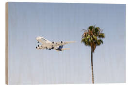 Obraz na drewnie Airbus A380 over palm trees