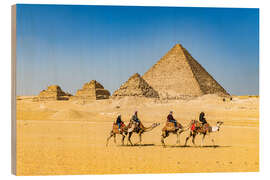 Puutaulu Camel riders in front of the pyramids of Giza